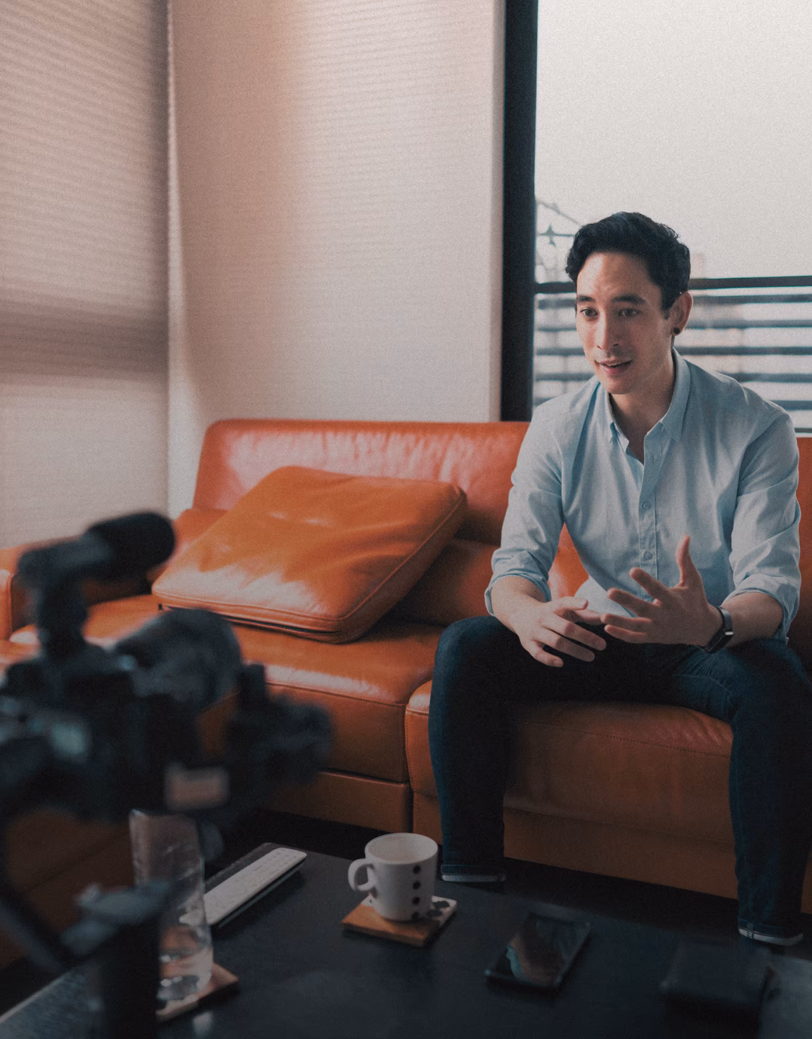 Man being filmed on couch